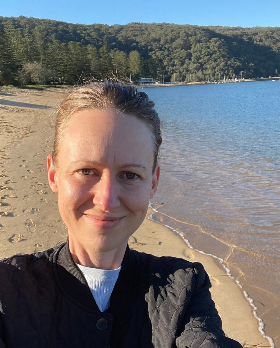 Kelly Luckman smiling on the beach